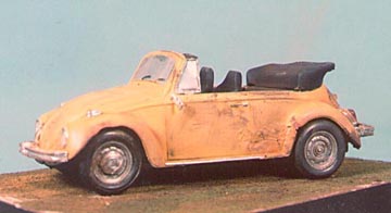 The same 1/25th scale Volkswagen Cabriolet, showing weathering on the left side. Besides the use of Marmo's Magic Dust, note the useless outside rear view mirror and the single dented hubcap.